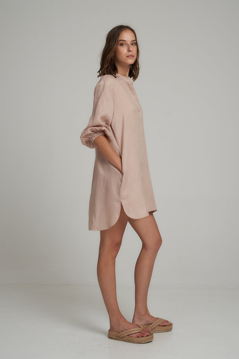 A Side View of a Natural Linen Shirt Dress with Pockets