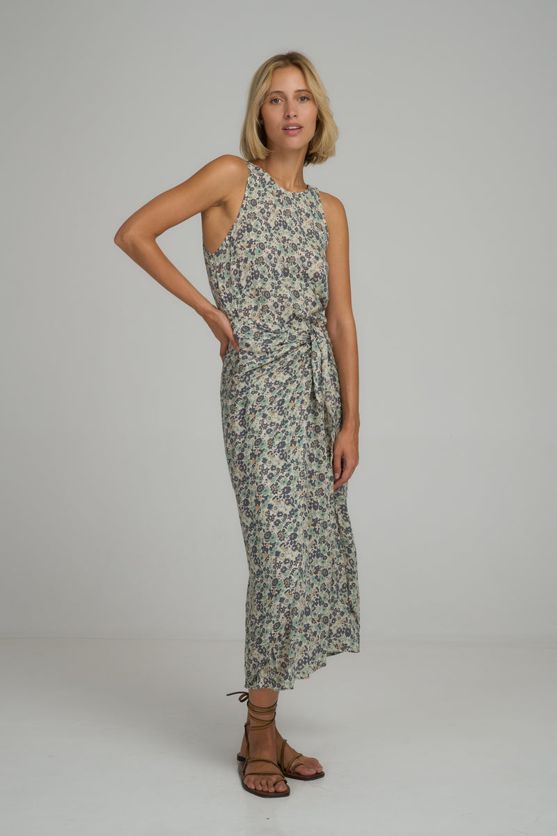 A model waring a blue floral maxi dress in Australia