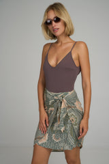 The Martini Wrap Mini Skirt in Batik Green by LILYA