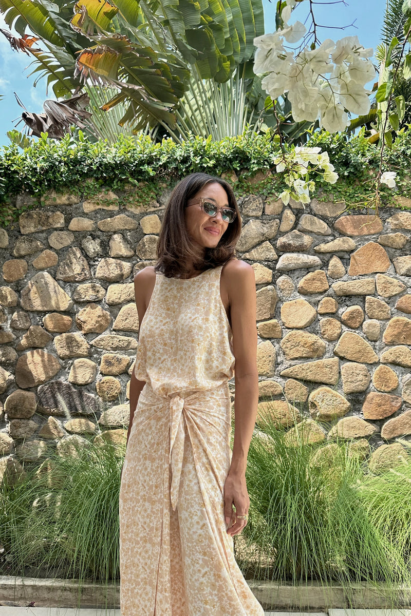 A woman wearing a summer floral midi dress