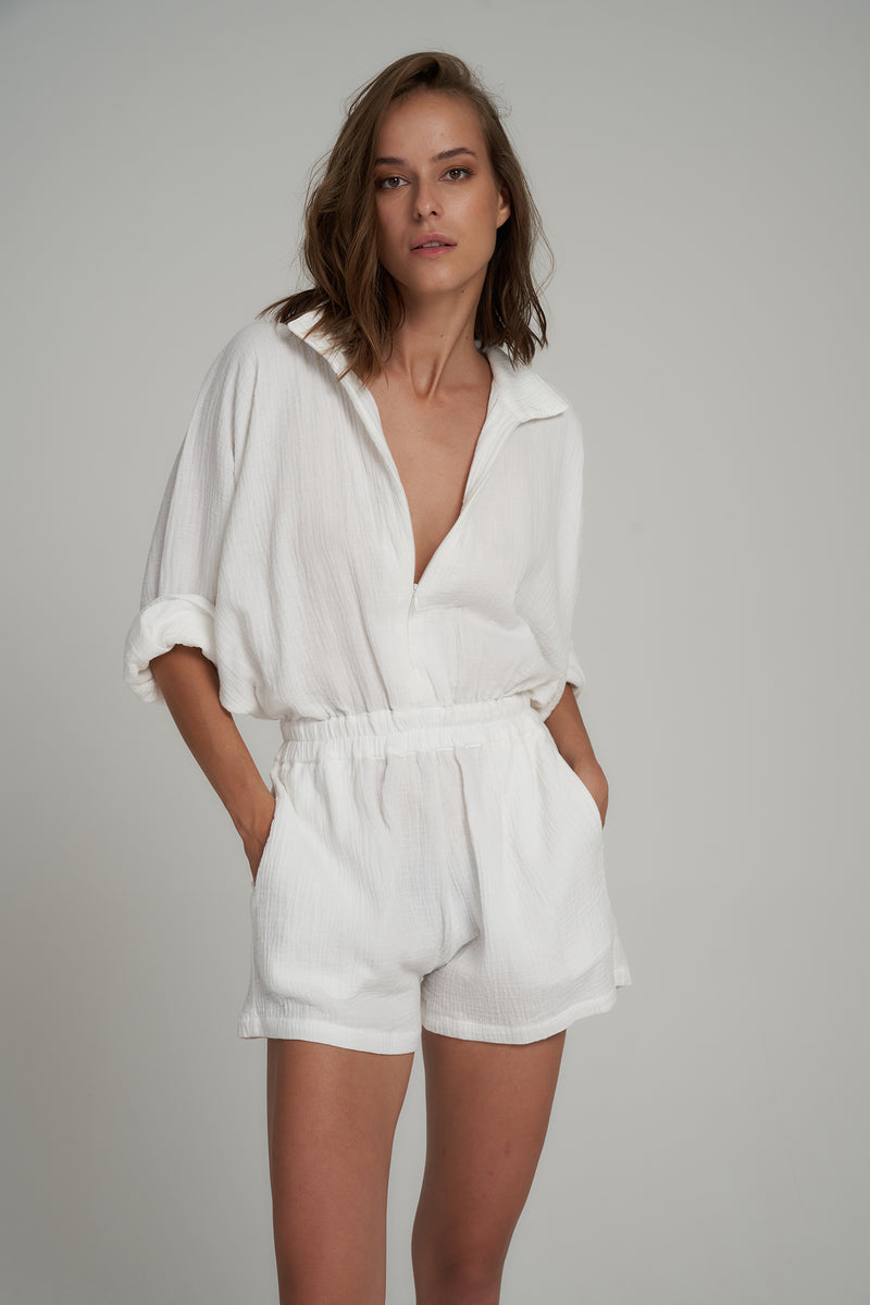 A Model Wearing a White Cotton Summer Jumpsuit