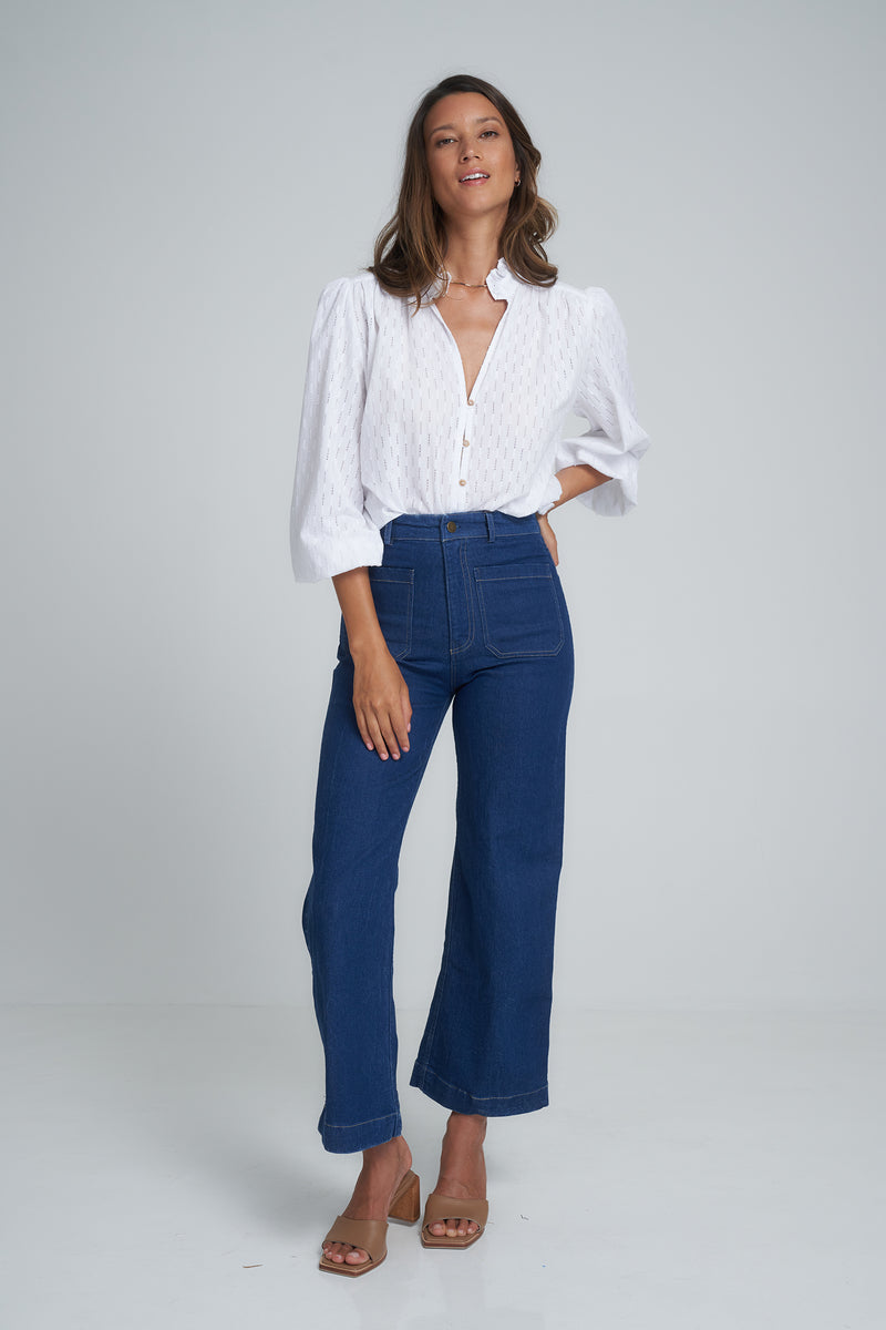 A Model Wearing a Classic High Rise Blue Denim Jean in Australia