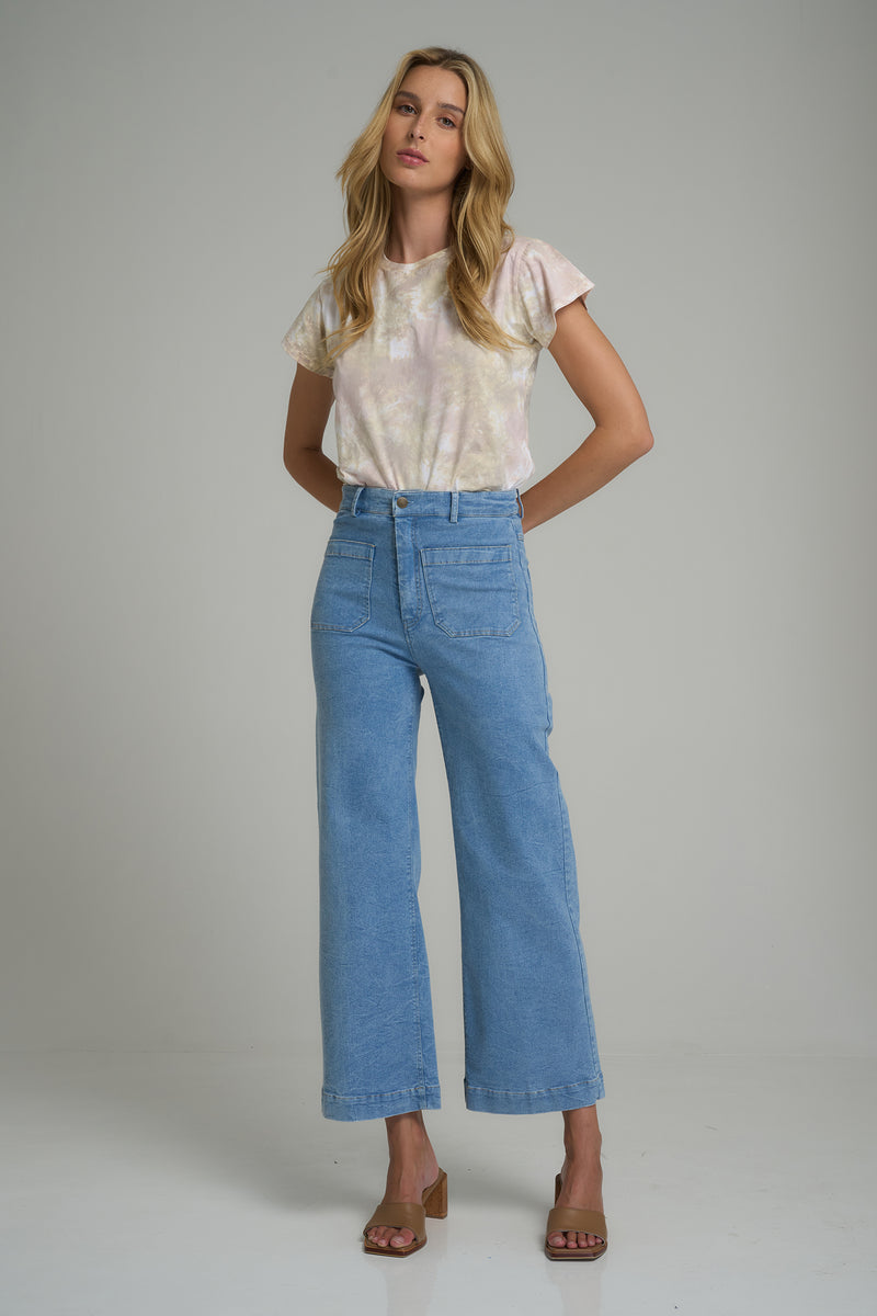 A model wearing pale blue denim jeans with front pockets