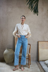 A model wearing the Molly Jeans in Pale Blue by LILYA