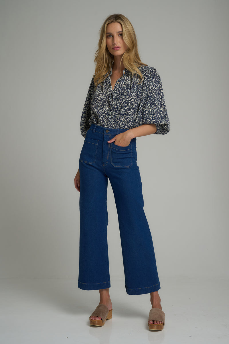 A model wearing high rise denim jeans for women