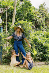 Jess wears monty navy top tied up with the dark denim jeans from the JKB x LILYA collab