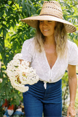 Ivory broderie anglaise top on Jess from JKB in her garden 