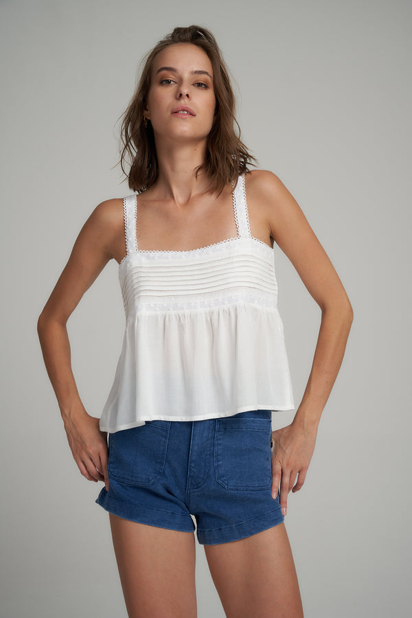 A Model Wearing a White Cotton Pleat Summer Top