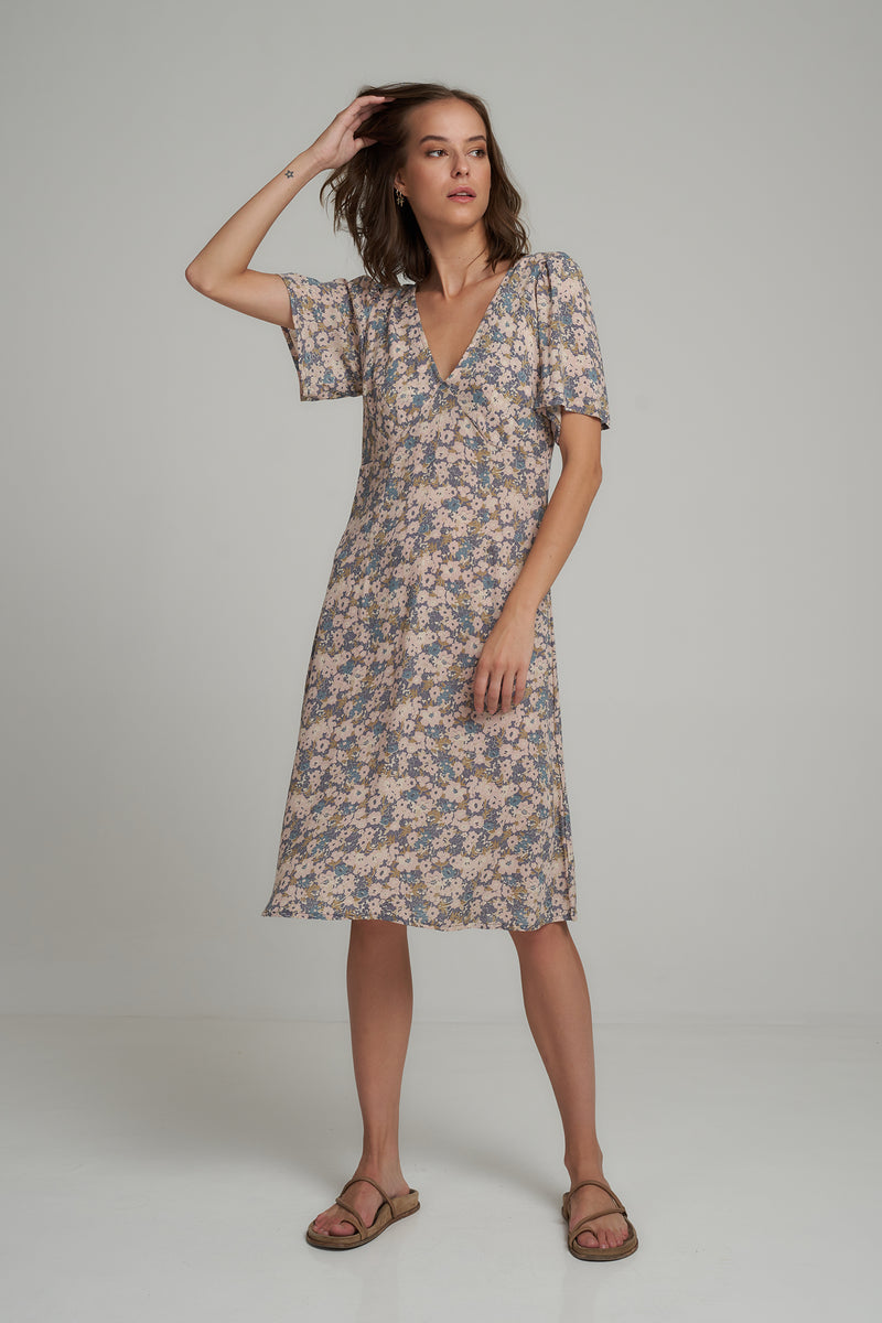 A Model Wearing a Blue Floral Midi Casual Dress