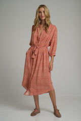 A woman wearing a floral midi dress for winter