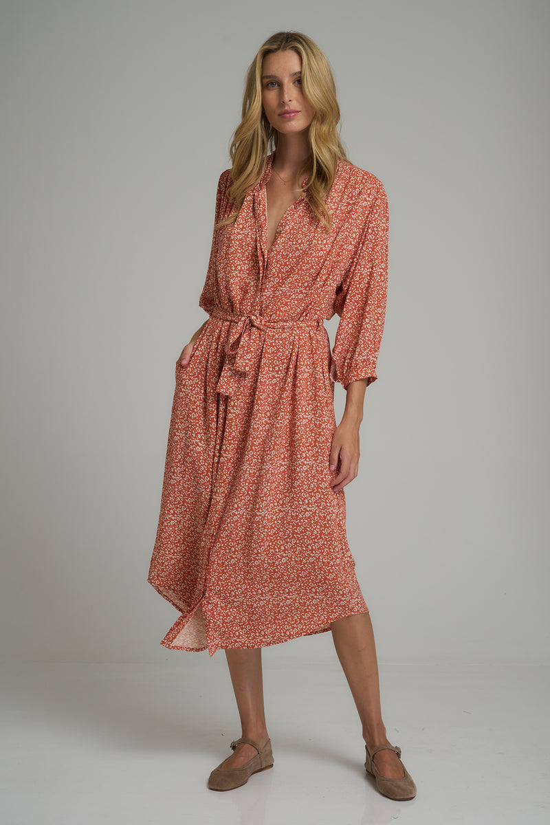 A woman wearing a floral midi dress for winter