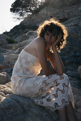 A model wearing a cotton lace dress in Italy