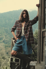 model wears plaid relaxed blazer layered for winter 