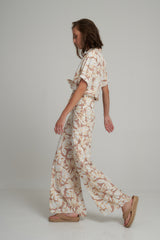 Side View of a Tropical Print Flare Pants by LILYA