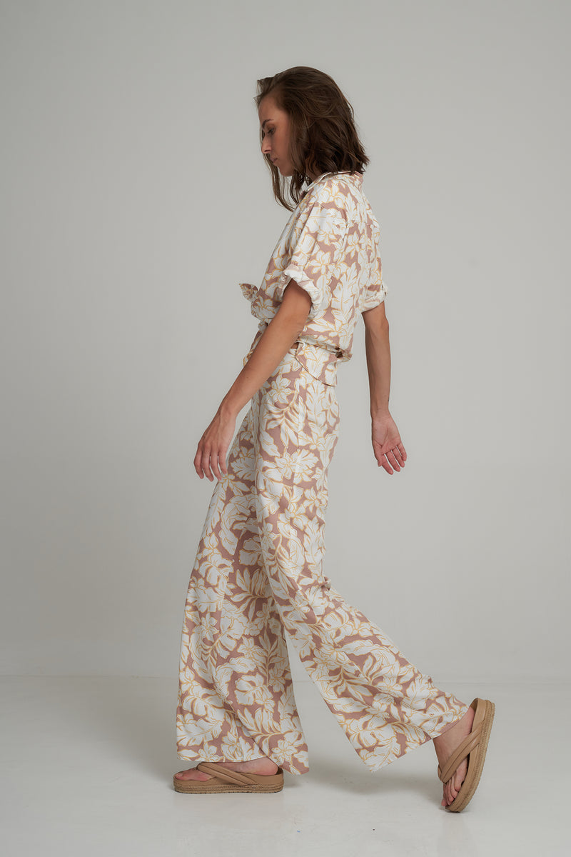 Side View of a Tropical Print Flare Pants by LILYA