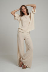 A Model Wearing Natural Cotton High Rise Flare Pants