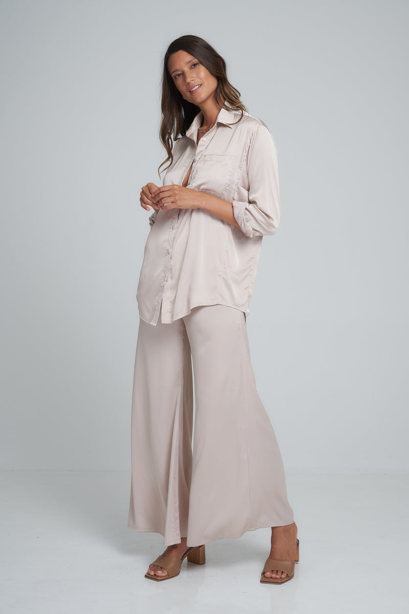 A Model Wearing the Olina Wide Leg Silky Pants Oyster by LILYA