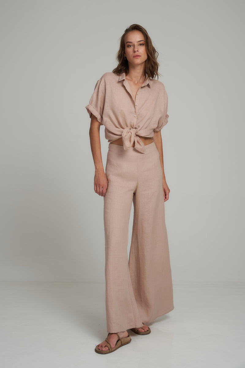 A Model Wearing Tailored Natural Linen Pants by LILYA