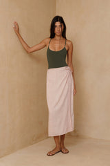 Woman wearing orchidea swim by lilya in a green colour with thin straps