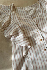 Flat lay image of stripe print blouse