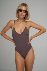 A model wearing a chocolate brown one-piece for Summer