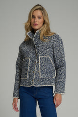 A model wearing a navy and ivory winter jacket with pockets