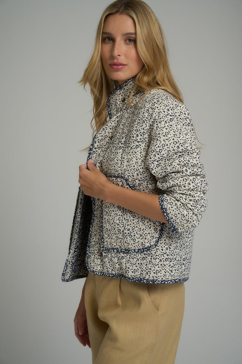 A model wearing a warm floral winter jacket