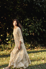 A Woman Wearing a Yellow Floral Maxi Dress for Summer