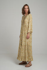 A Model Wearing a Yellow Floral Maxi Layered Dress