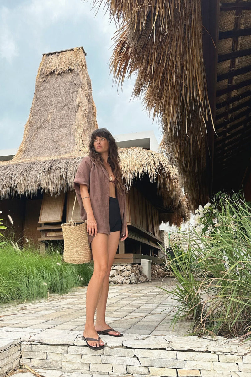 Girl wears lilya rattan rope basket bag