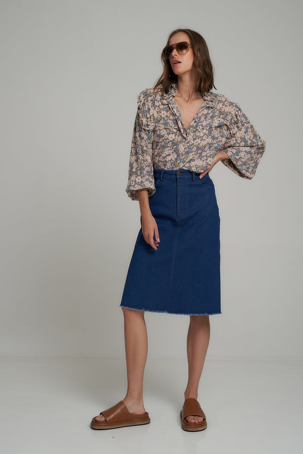 A Woman Wearing a High Waisted Denim Midi Skirt by LILYA