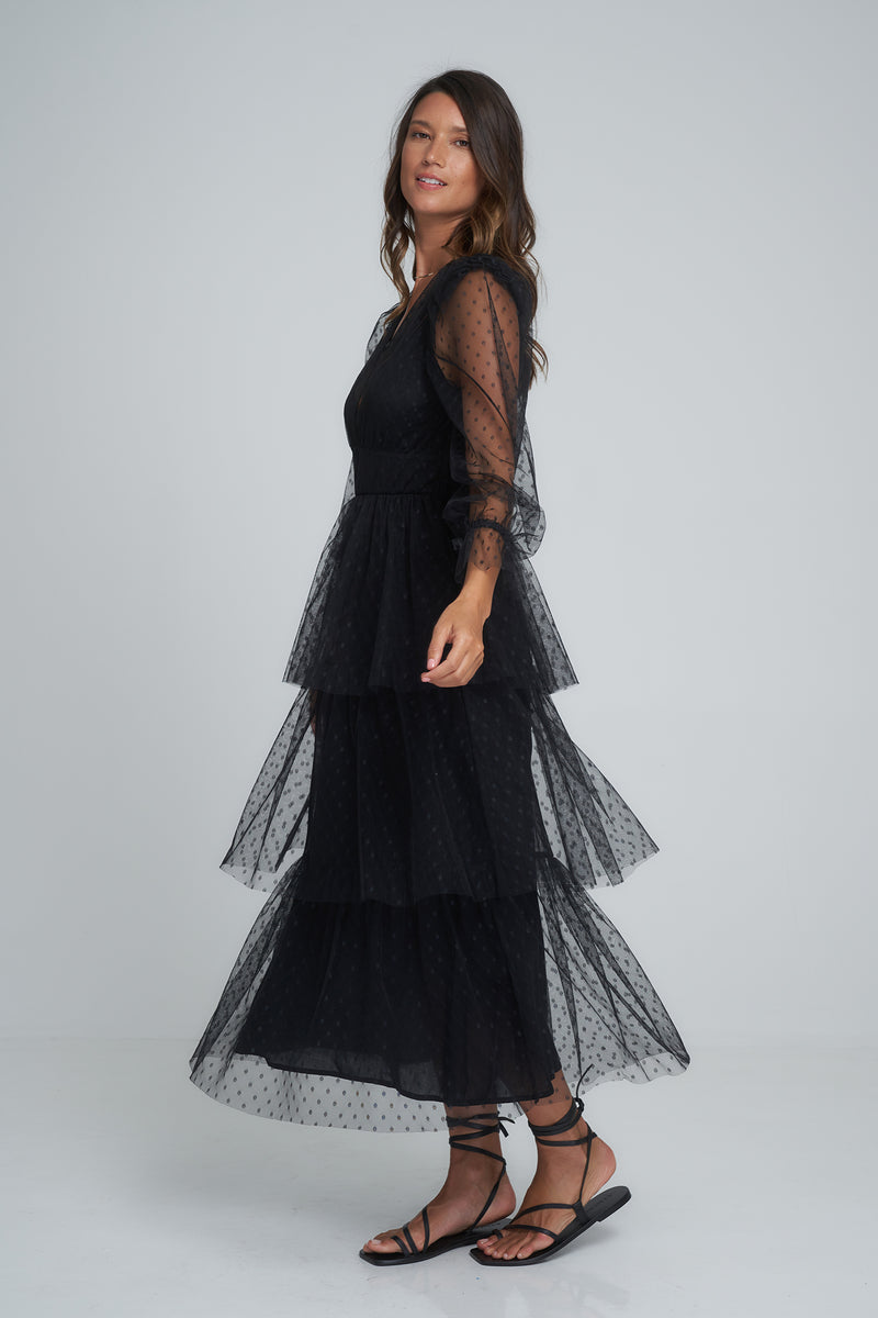 A woman wearing a black lace dress in Australia