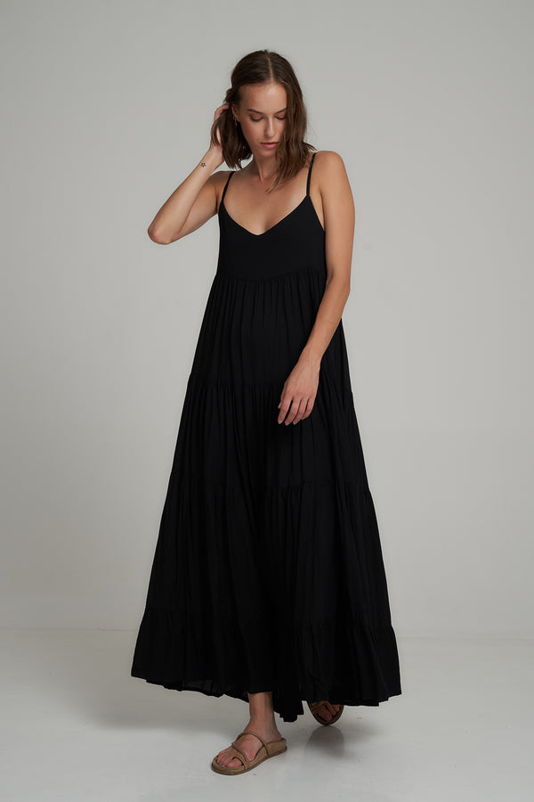 A Model Wearing a Black Cotton Maxi Dress by LILYA