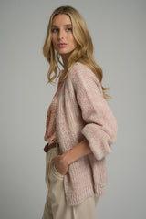 A model wearing a pink longline cardigan