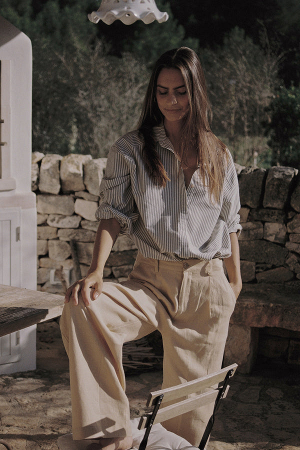 A model wearing a tan linen dress pants