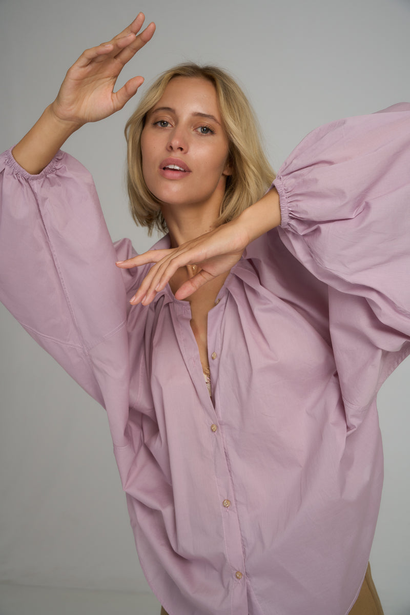 A model wearing the Sienna Cotton Top in Lilac by LILYA