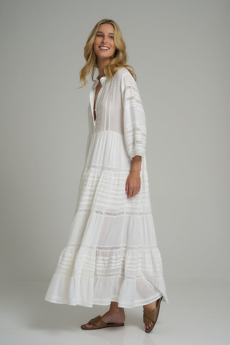 A model wearing a white lace maxi dress in Australia