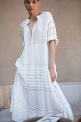 A model wearing a white cotton maxi dress by LILYA