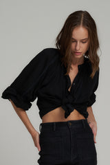 A Model Wearing a Loose Classic Button Through Top