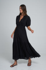 A Model Wearing an Elegant Black Midi Dress 