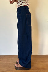 Side image of dark denim jeans 