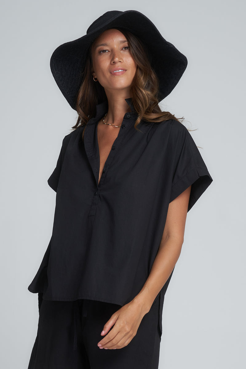 A Model Wearing a Black Short Sleeve Cotton Blouse