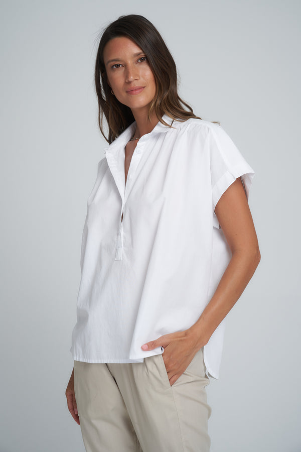 A Woman Wearing a White Cotton Short Sleeve Top