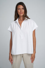 A Woman Wearing the Turks Top in White by LILYA