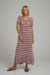 A model wearing the Vacance Crochet Maxi Dress in Lavender Ivory by LILYA