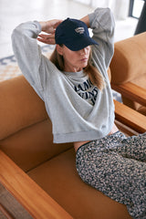 Model wearing womens hat with logo