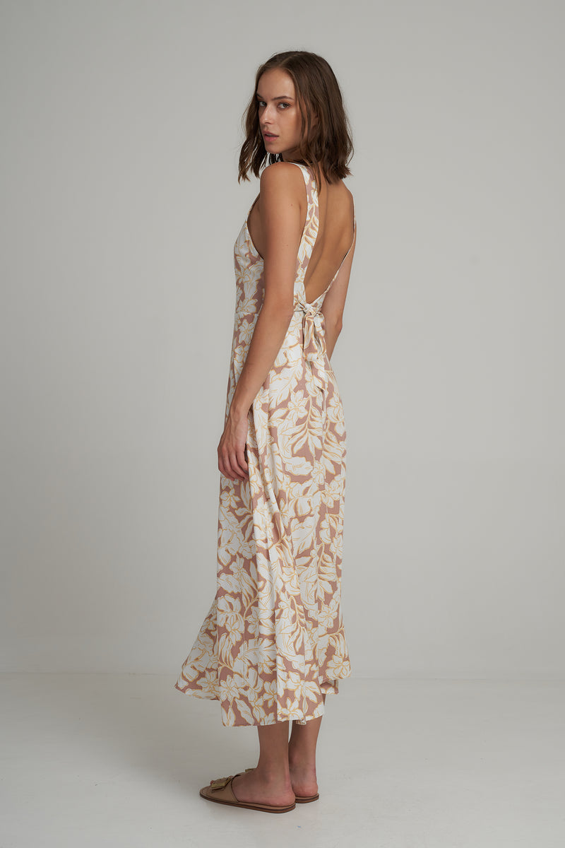 A Side View of a Backless Hawaiian Floral Maxi Dress