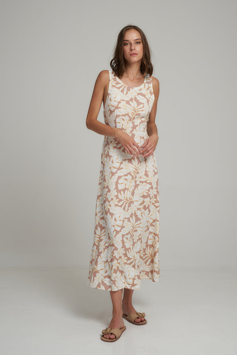 A Woman Wearing a Tropcial Floral Sleeveless Maxi Summer Dress