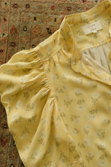 Detail of the soft puff sleeve on the Woodford Top in Yarrow Yellow.