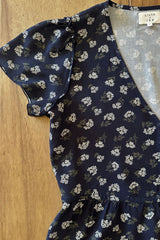 Close up of the frill sleeve detail on the Monty Navy Floral summer top. 